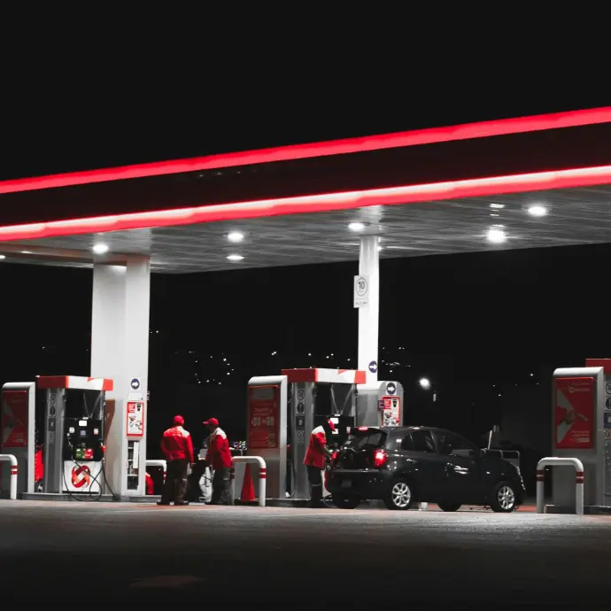 Fuel station with complete petroleum fuel system at night